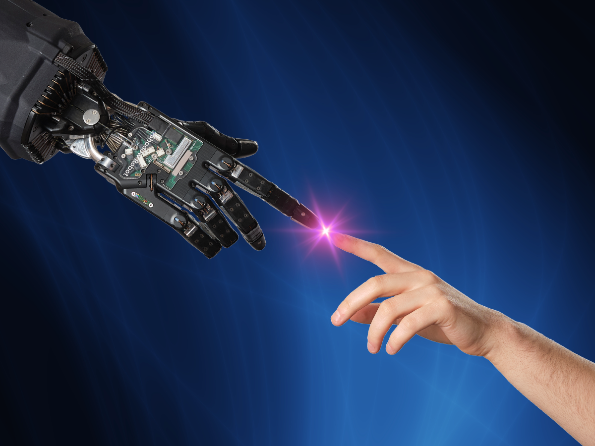 Home 12 robotic hand mirroring movement of human hand and about to touch